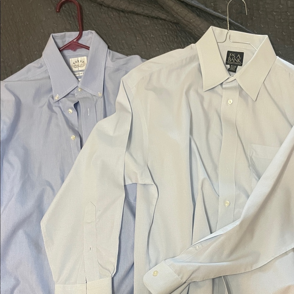 Two mens dress shirts.